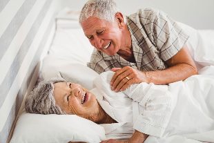 Elderly couple in bed